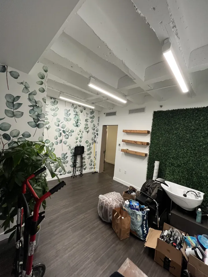 The bare salon during installation, before furniture styling