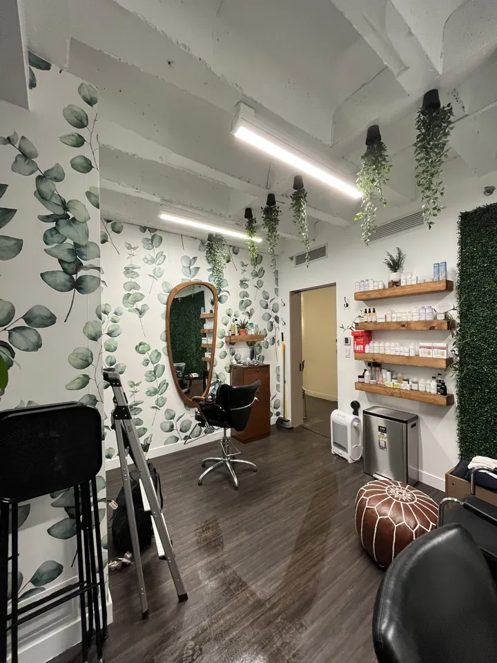 Styling stations with naturally shaped body-length mirrors and hanging planters