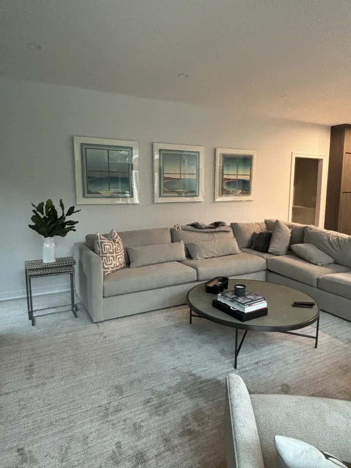 L-shaped microfiber sectional facing the media wall in Harrison NY