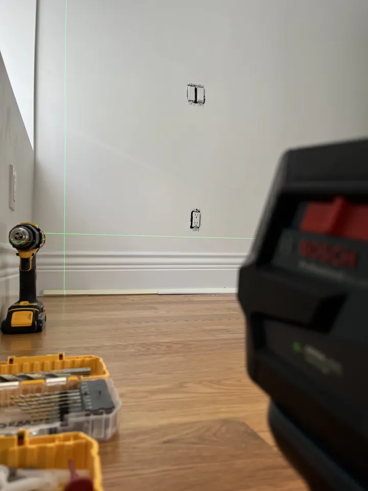 Laser level projecting a precision guide line during an installation