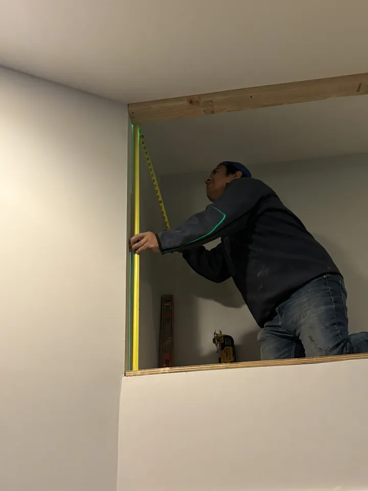 Framing the loft cavity against the angled vaulted ceiling