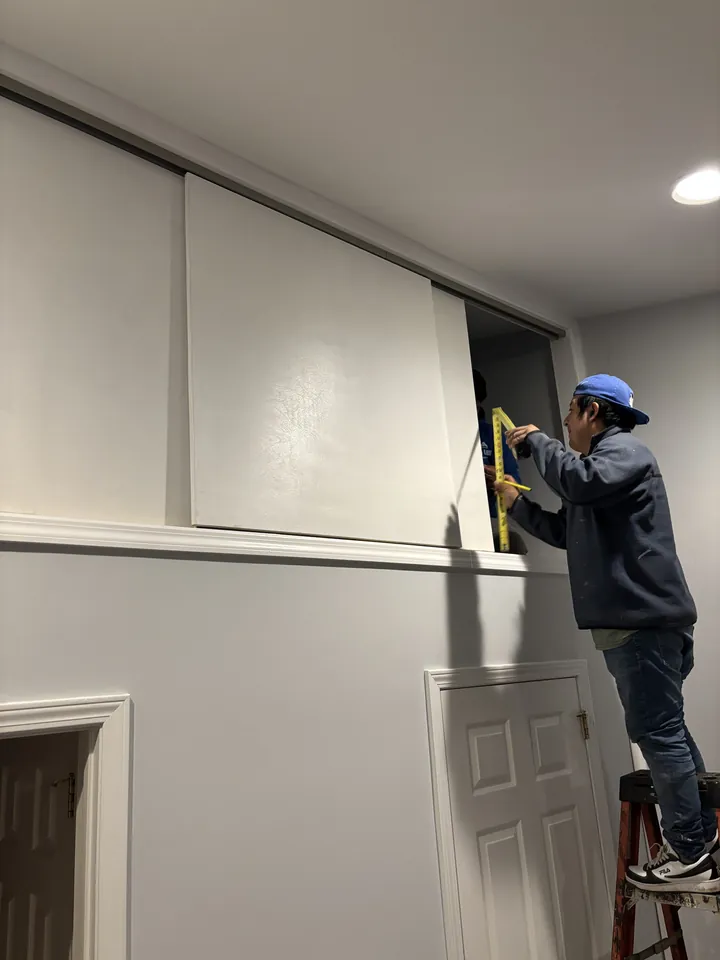 Installing the 3-way sliding door track on the loft enclosure