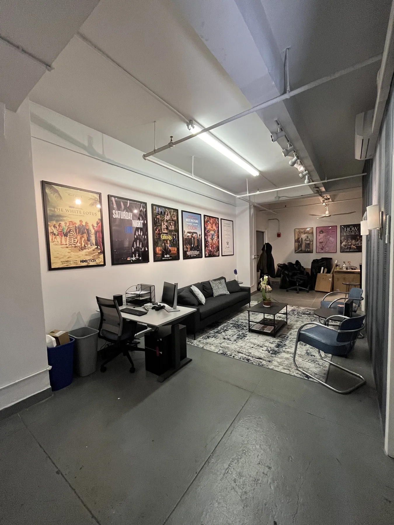 Mosaic NYC office lounge wrapped in black and white maze pattern wallpaper