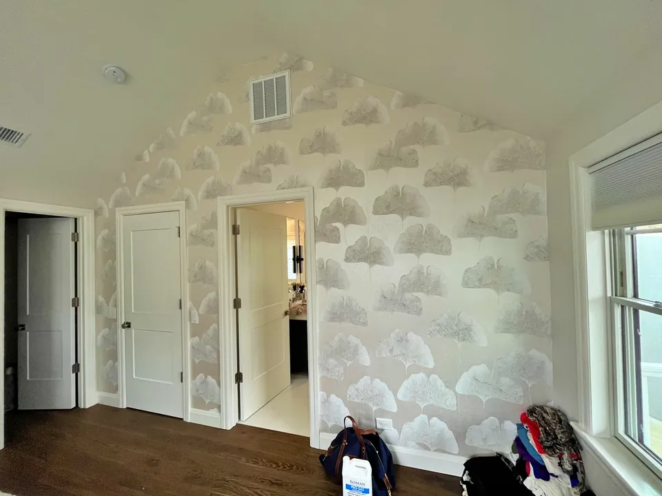 Cloud pattern wallpaper during installation in the White Plains bedroom