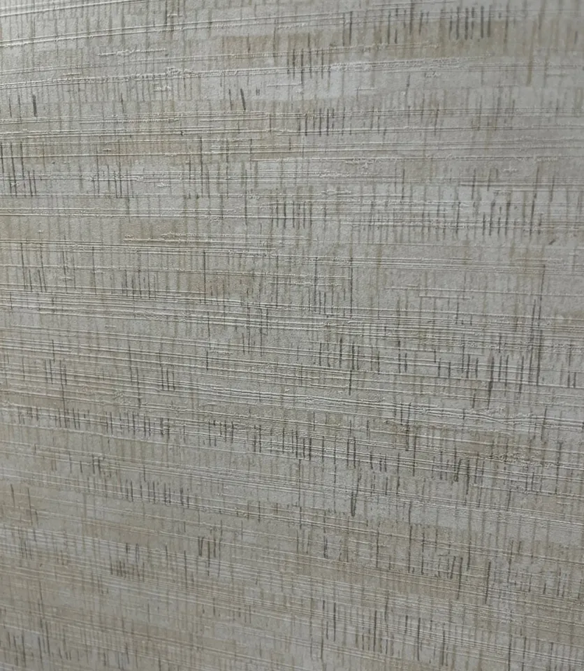 Close detail of the oatmeal hued grasscloth wallpaper texture
