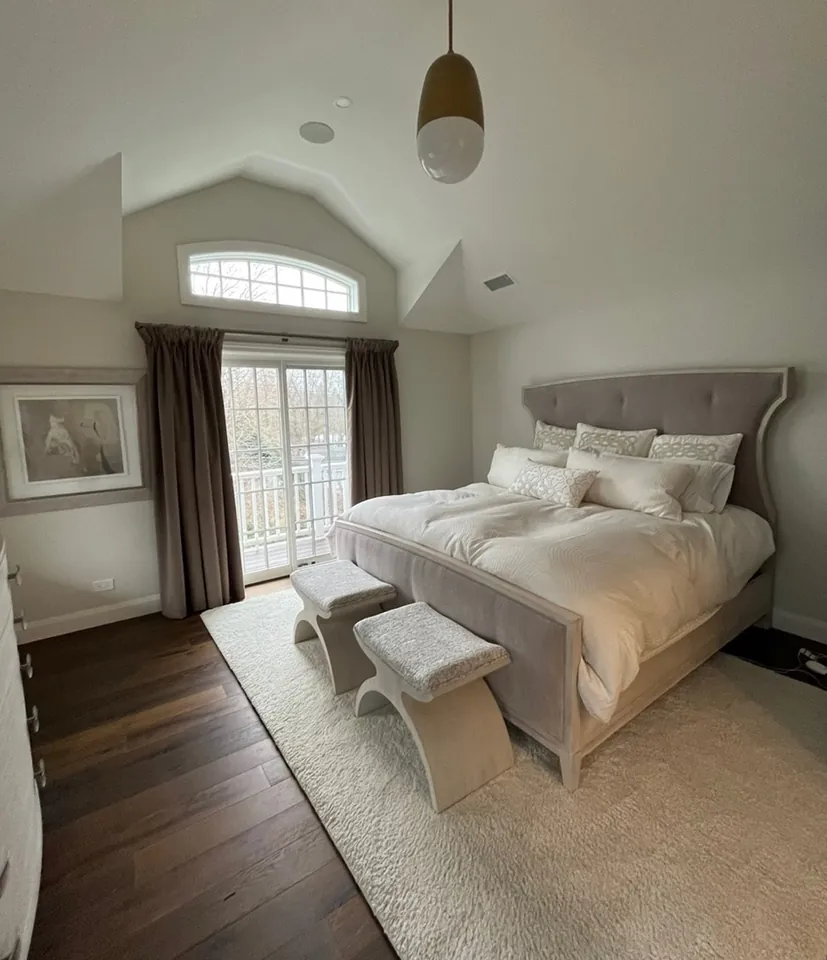 Serene bedroom refreshed with soft paint and cloud pattern wallpaper